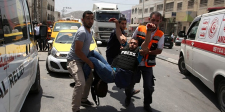 Photojournalist wounded in West Bank